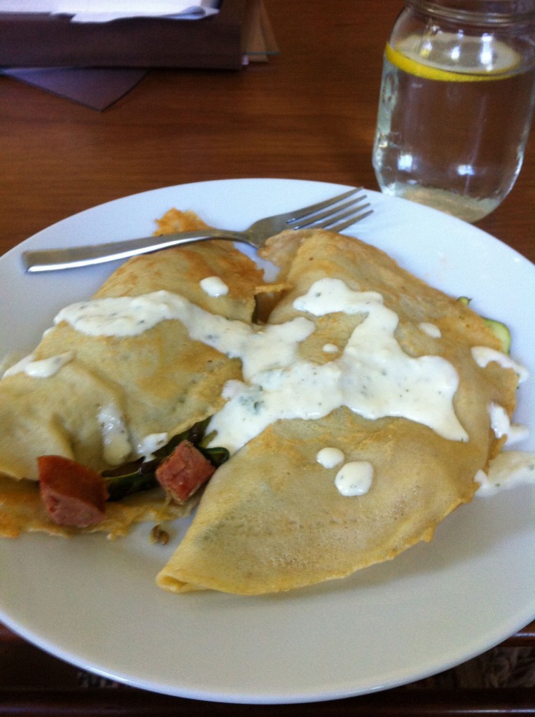 crepes with sauteed zucchini, asparagus and hot Italian sausage with brie cream sauce
