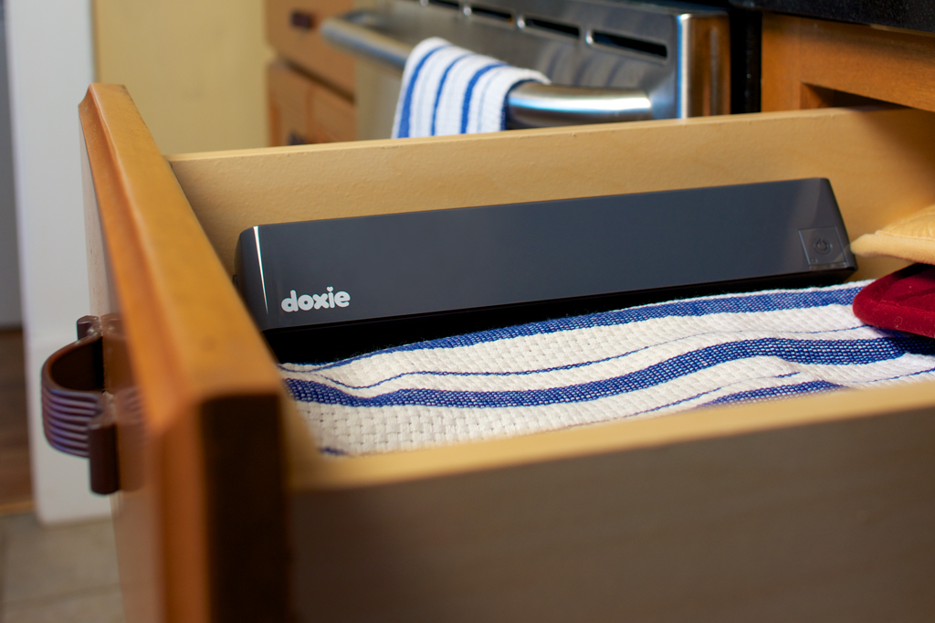Doxie scanner sitting in a kitchen drawer